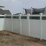 Privacy Fence with Green Lattice